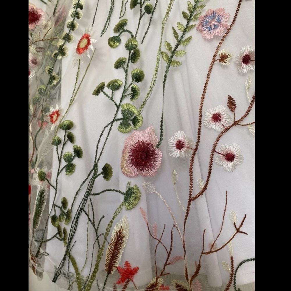 White formal dress with flower overlay
